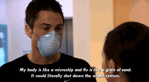 A gif of Chris Traeger from Parks and Rec, in a mask, saying "My body is like a microchip and flu is like a grain of sand. It could literally shut down the whole system.